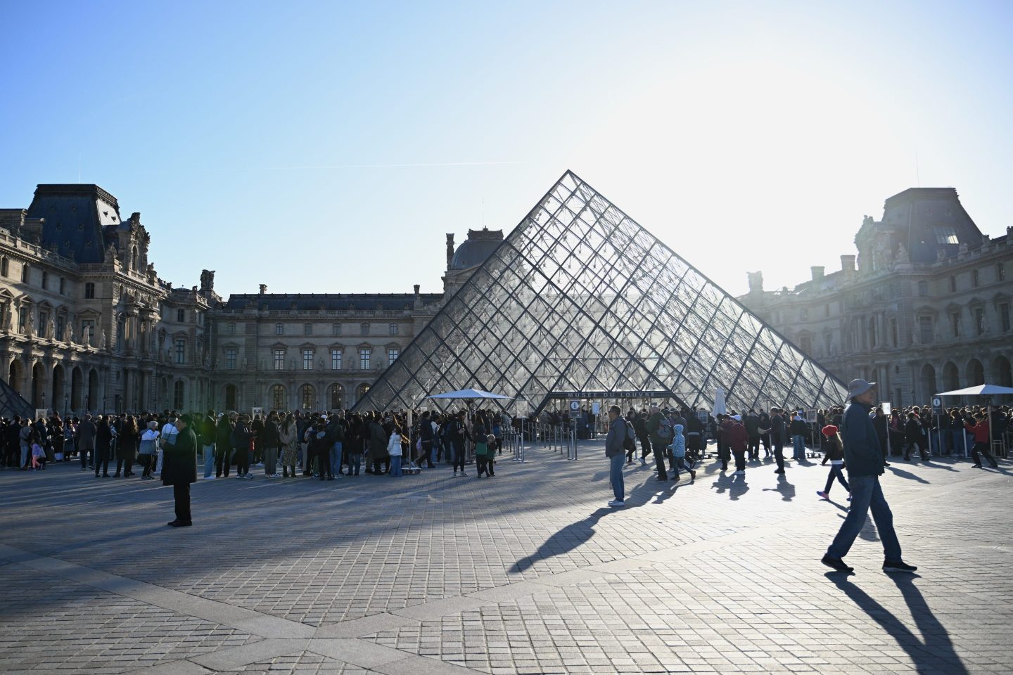 People walking outside the Louvre