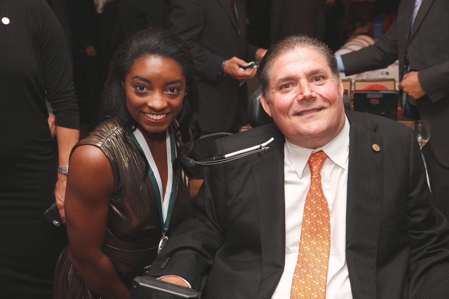 Simone Biles, left, poses with The Buoniconti Fund to Cure Paralysis President Marc Buoniconti at the 2018 Great Sports Legends Dinner.