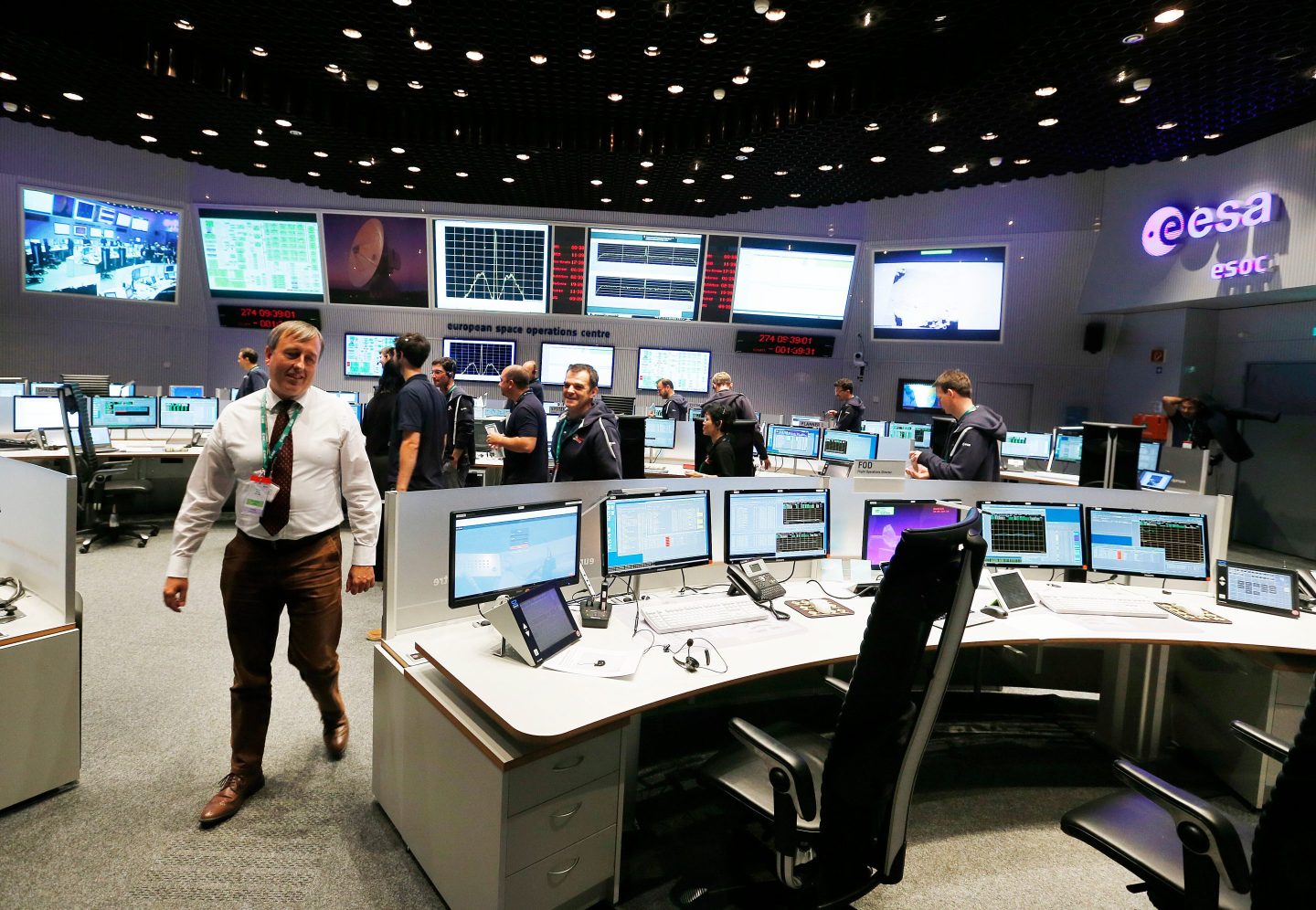 Inside of a European Space Agency control room filled with people