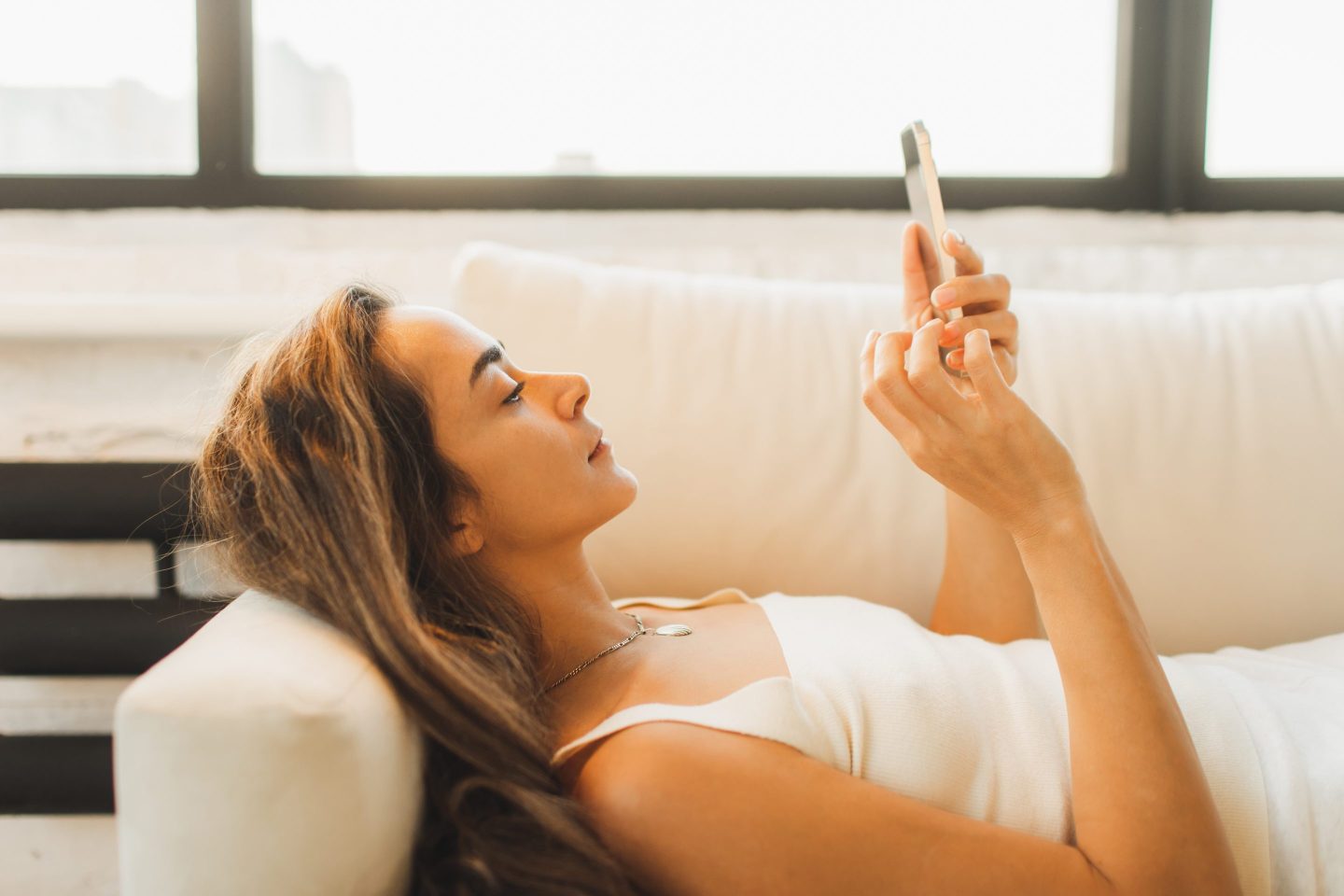 Female worker slacking off on her phone