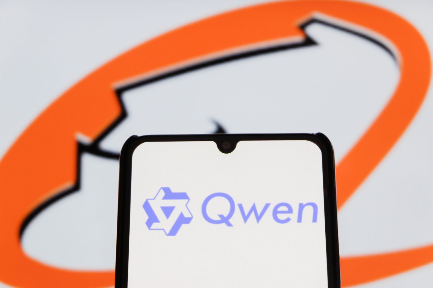 Smartphone displaying the logo of the Qwen app. Qwen is the open source AI model made by Chinese internet giant Alibaba.