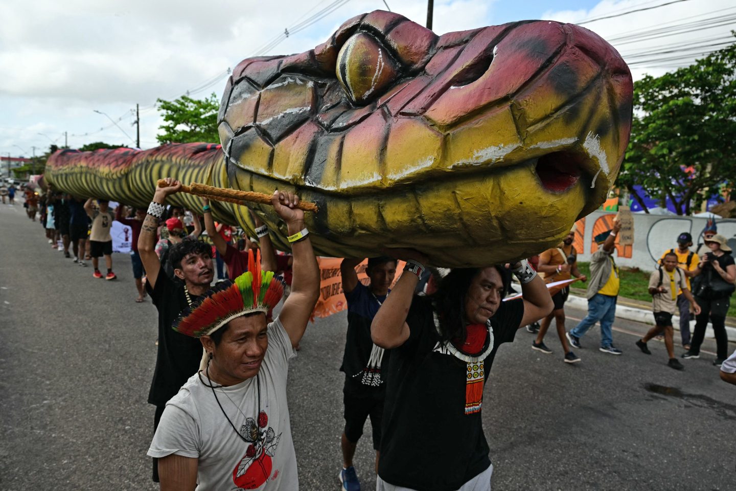 Indigenous people take part in a demonstration called "Indigenous People Global March" during the COP30 UN Climate Change Conference in Belem, Para state, Brazil, on November 17, 2025. (Photo by Pablo PORCIUNCULA / AFP) (Photo by PABLO PORCIUNCULA/AFP via Getty Images)