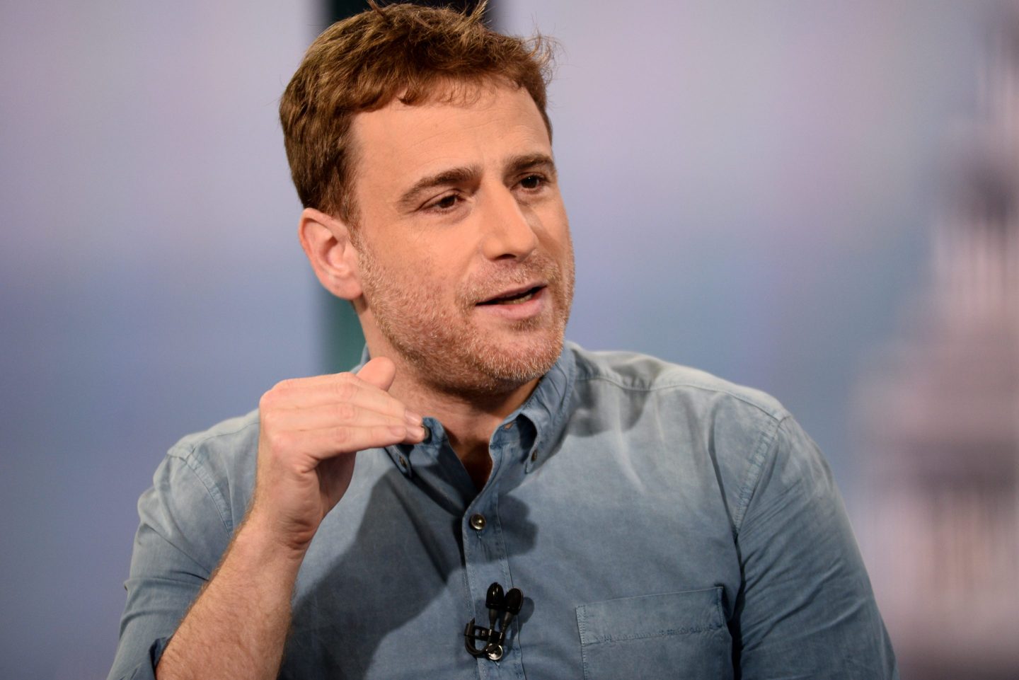 Slack cofounder says workers and CEOs can get stuck doing ‘fake’ work like pre-meetings and slide shows